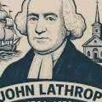 Modern commemorative badge captioned JOHN LATHROP, showing a clergyman in a powdered wig and preaching bands between a sailing ship and a meeting house.